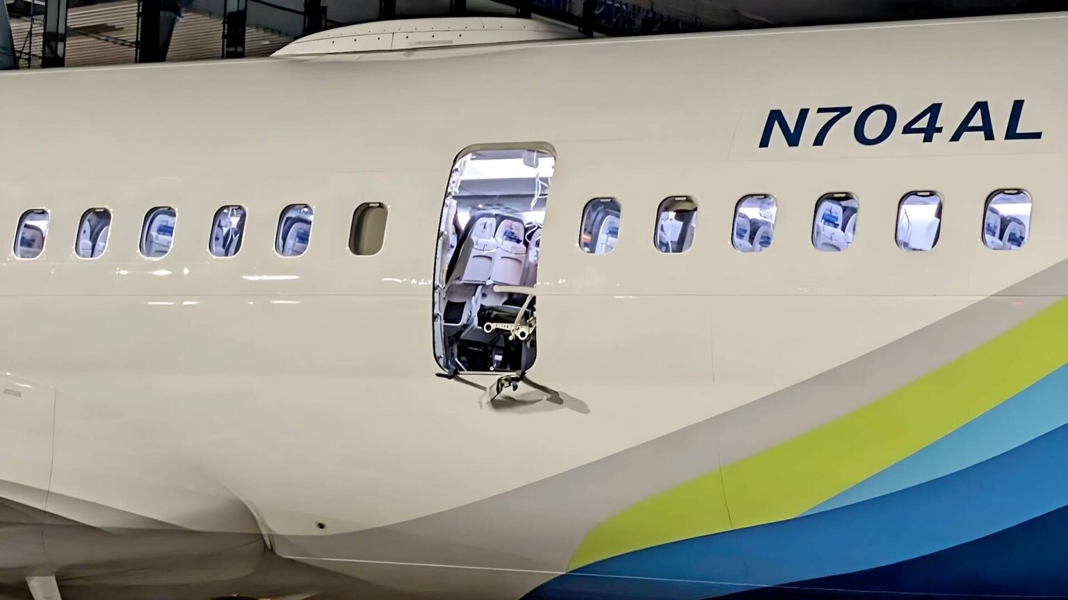 a white airplane with a door open