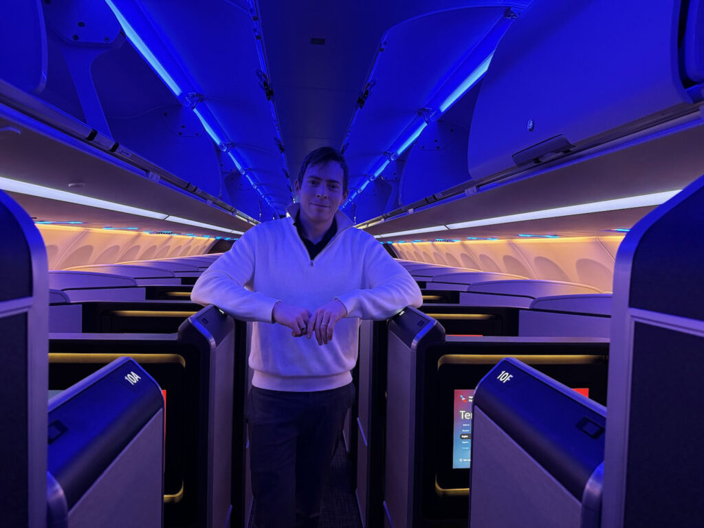 a man standing in an airplane