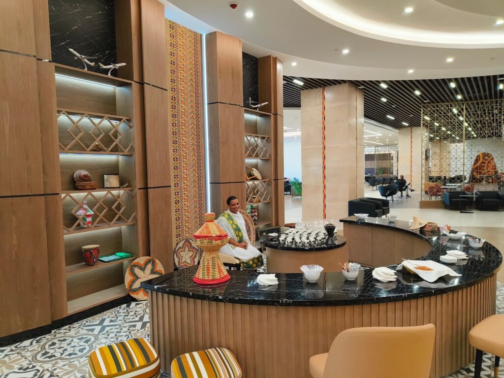 a man sitting at a counter in a hotel