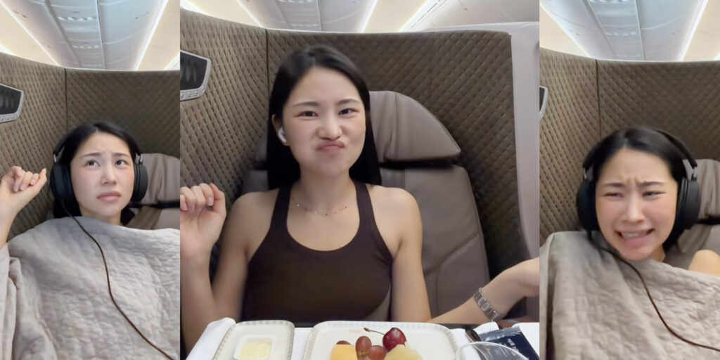 a woman sitting in a chair with food on it