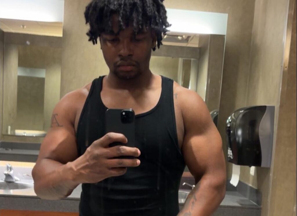 a man taking a selfie in a bathroom