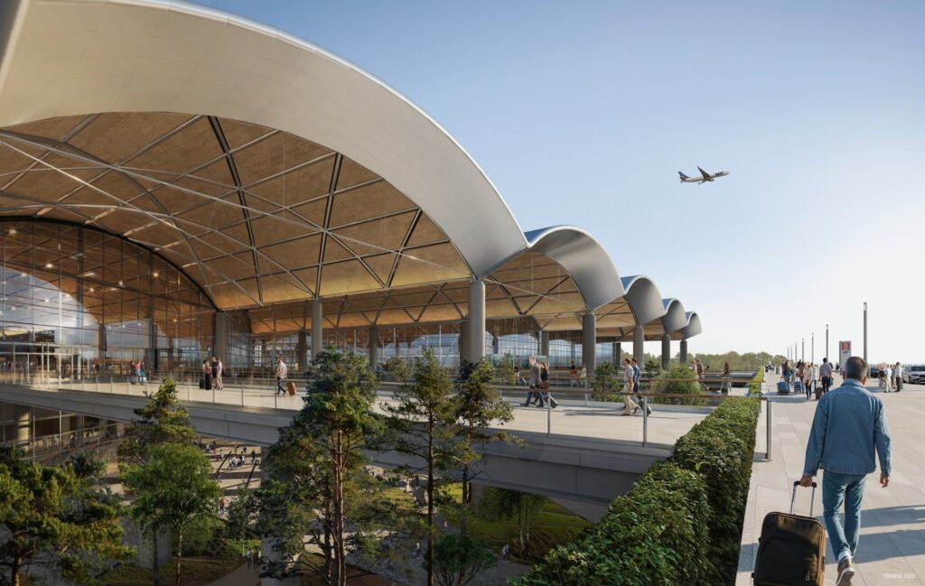 a building with a roof and trees