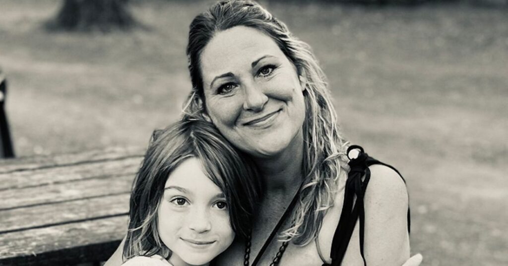 a woman and a child posing for a picture