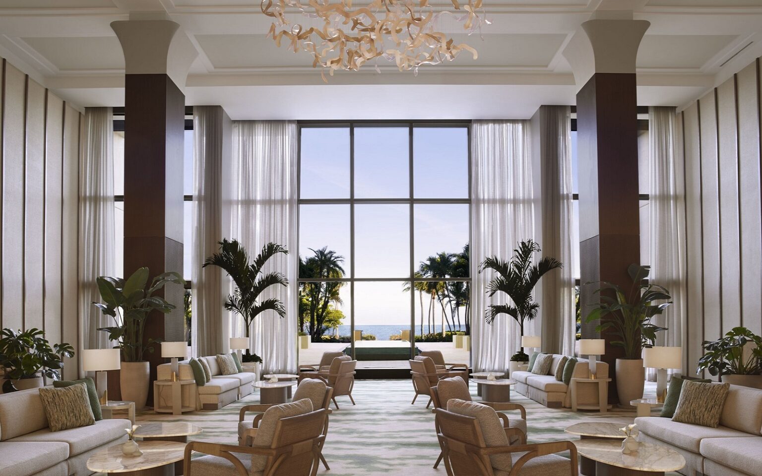 otel lobby with chairs and palm trees in Ritz-Carlton-Key-Biscayne