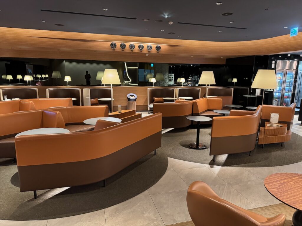 a room with brown couches and tables