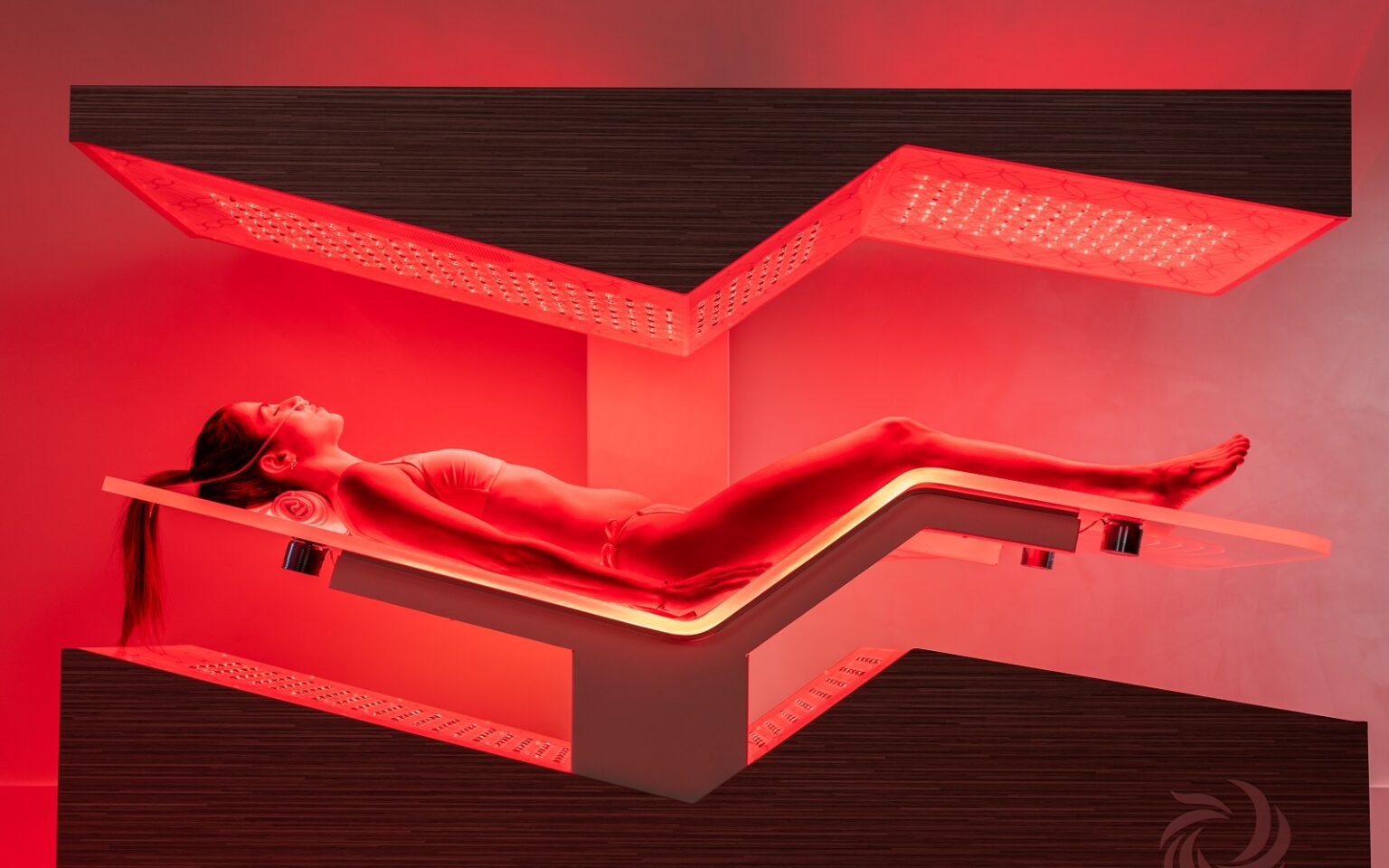 wellness trends - woman lying on Ammortal infra red bed