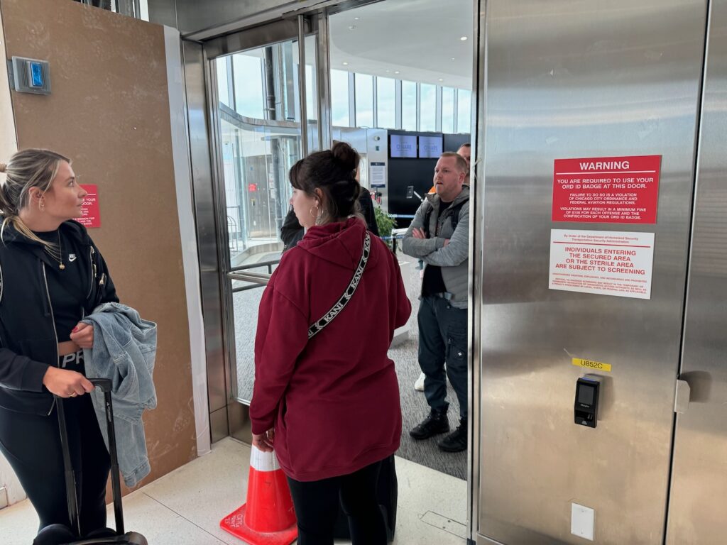 International Arrival Mistake At Chicago O’Hare Created A Serious Security Breach a woman standing in front of an elevator