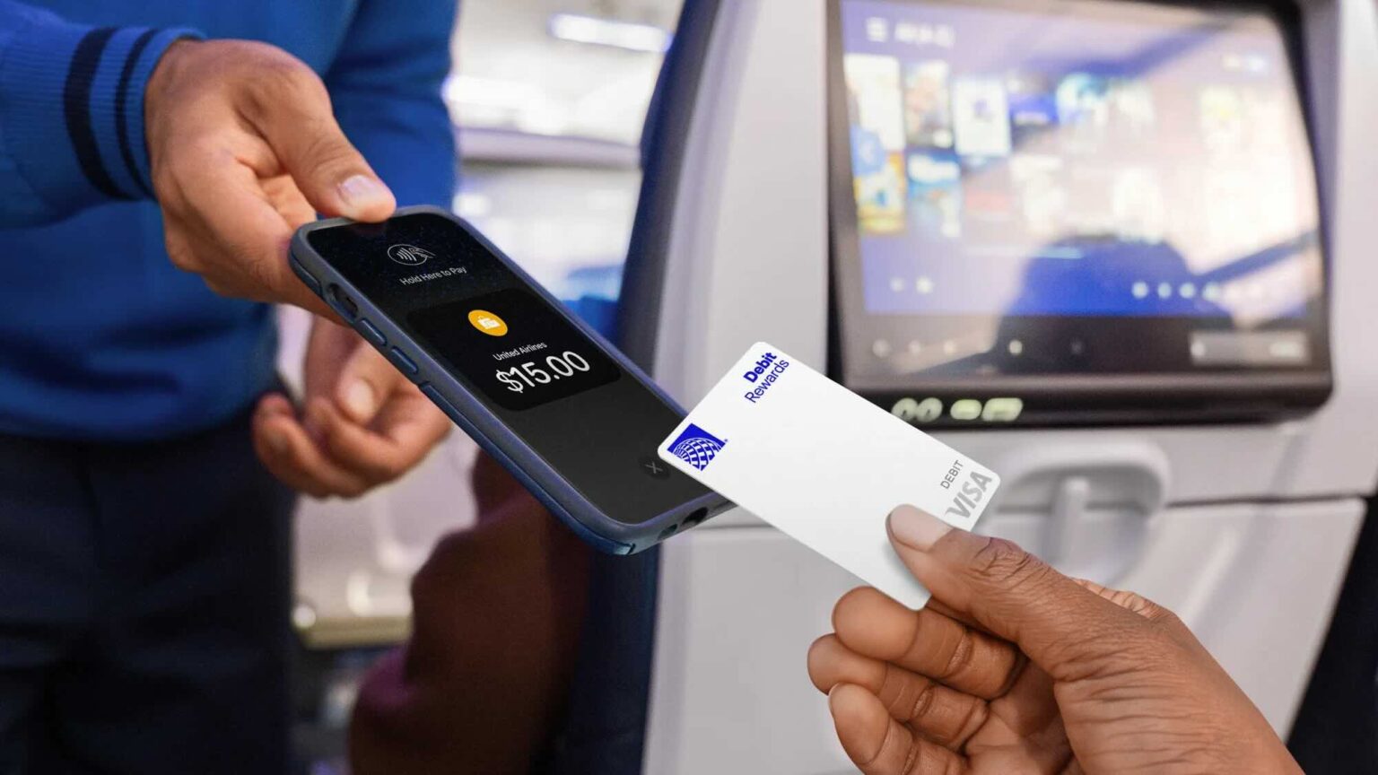 a person holding a credit card and a phone
