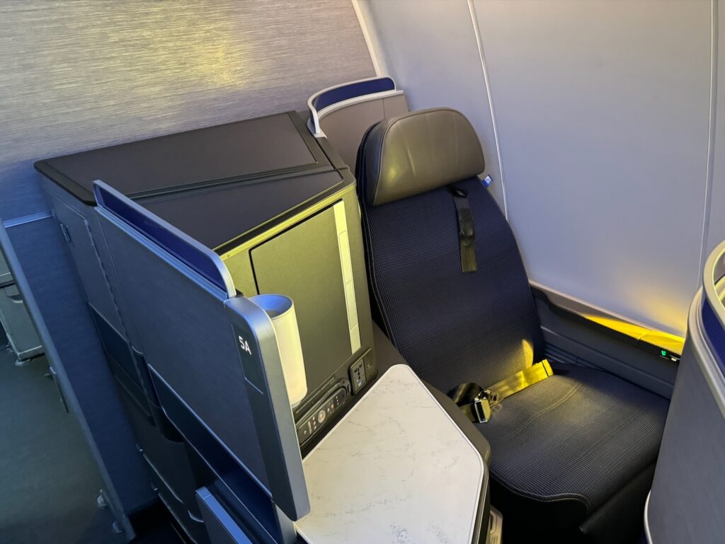 a seat and a table in a plane