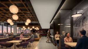 a group of people sitting at tables in a restaurant