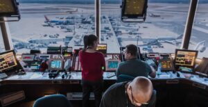 How The FAA Handles Civilian Airspace When Military Operations Intersect people in a control room