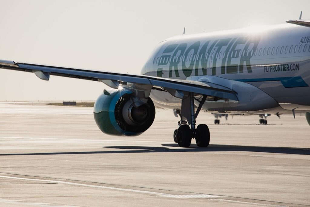 Frontier Airlines Is Retreating From JFK After Just Two Years the wing of a plane
