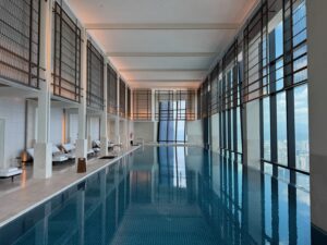 a indoor pool with a large window