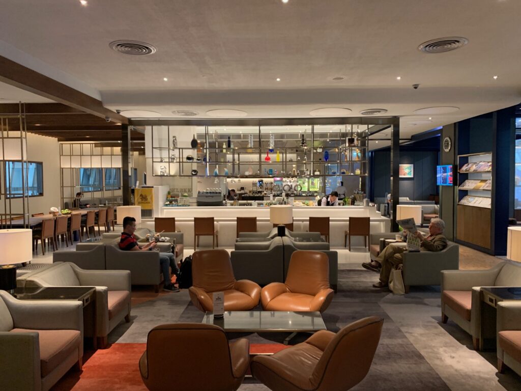 a restaurant with a glass wall and people in it