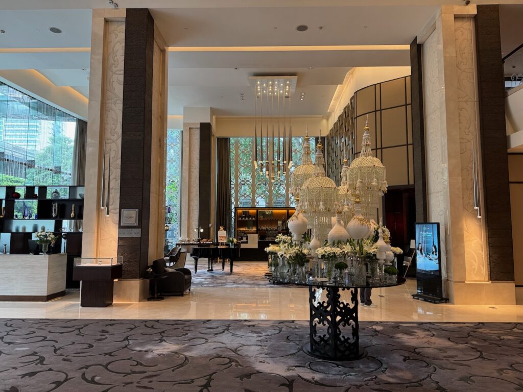 a large room with chandeliers and a table