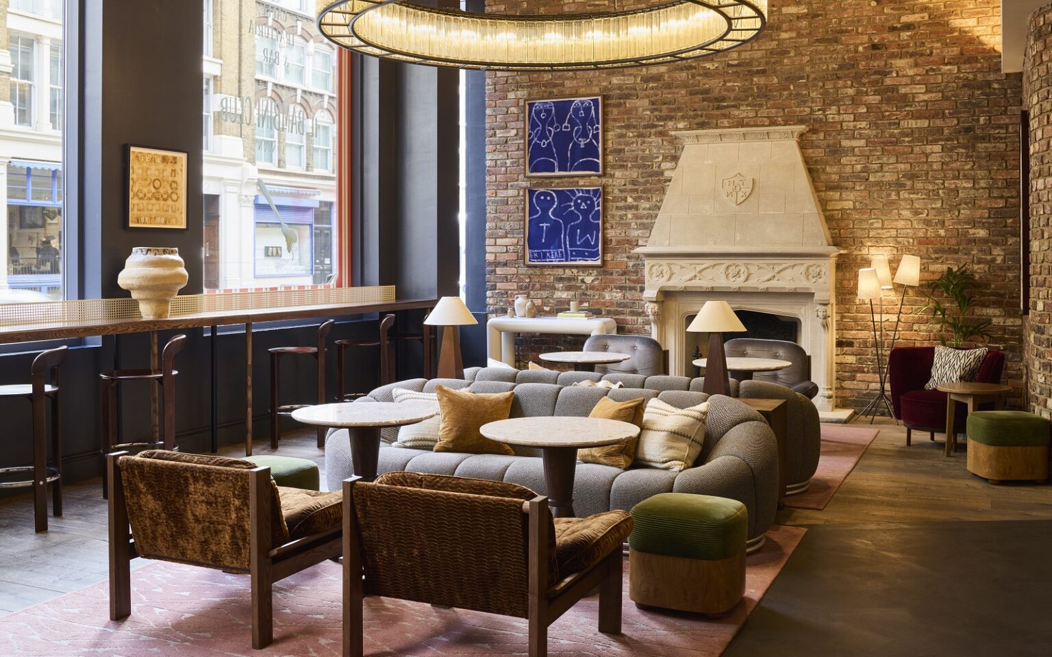 seating by fireplace in The Hoxton Shoreditch lobby