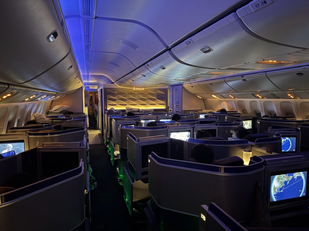 an airplane with seats and a television