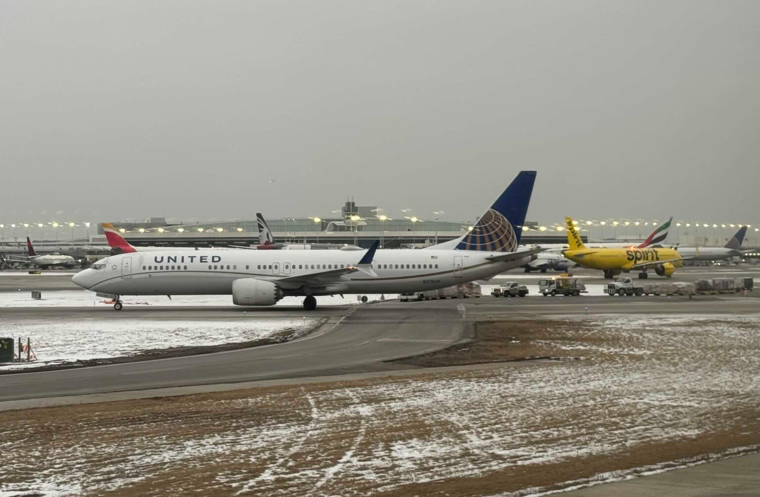 a group of airplanes on a runway