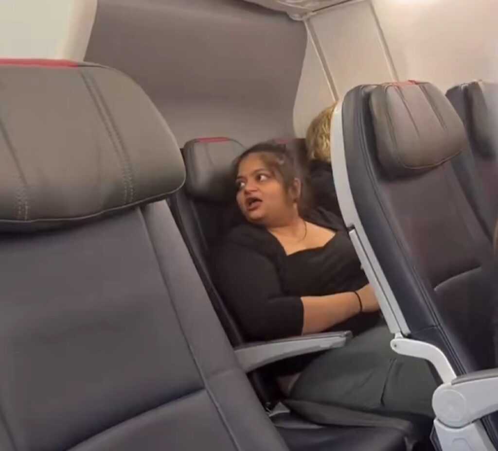 a woman sitting in a plane