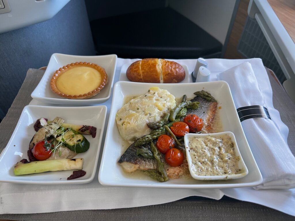 American Airlines Catering Meltdown in London Leaves Premium Cabins Bare Bones a plate of food on a table