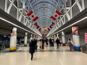 Analysis: FAA Flight Cuts At Chicago O’Hare Will Benefit American, United, And Travelers a group of people walking in a building