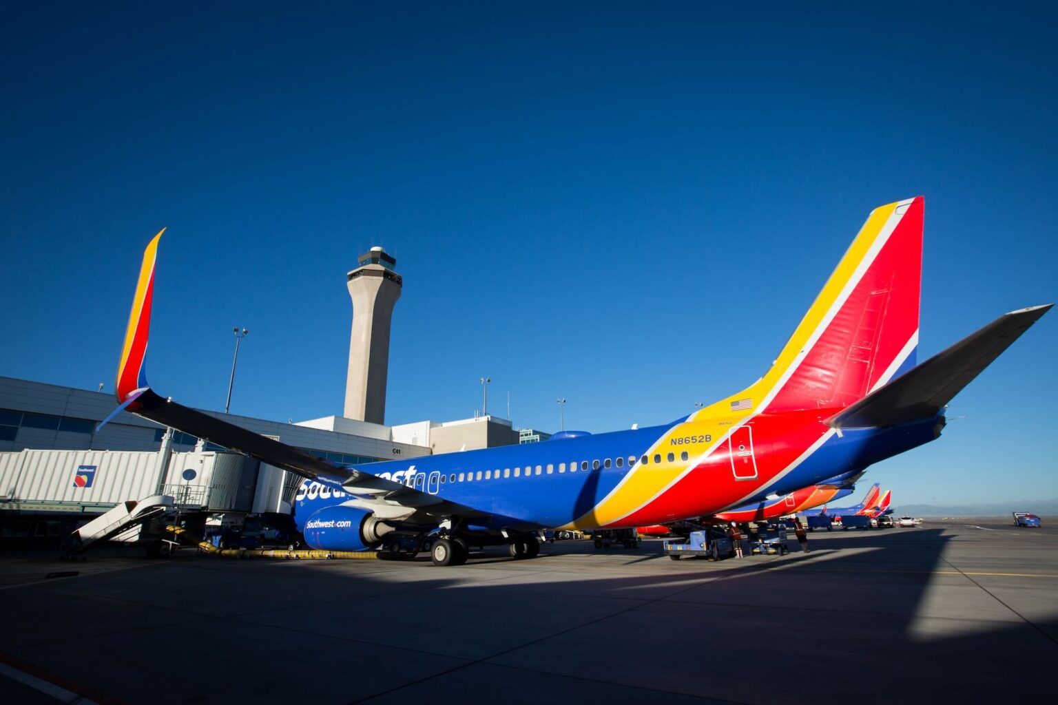 Southwest Airlines Ends Flights To Chicago O’Hare And Washington Dulles, A Boost For United a colorful airplane parked at an airport