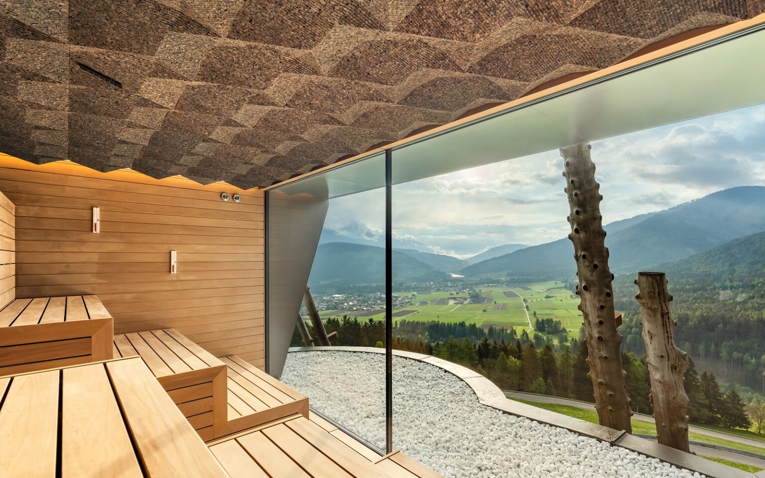 Hotel Hubertus elevates wellness in the heart of the Dolomites view across dolomites from sauna at Hotel Hubertus