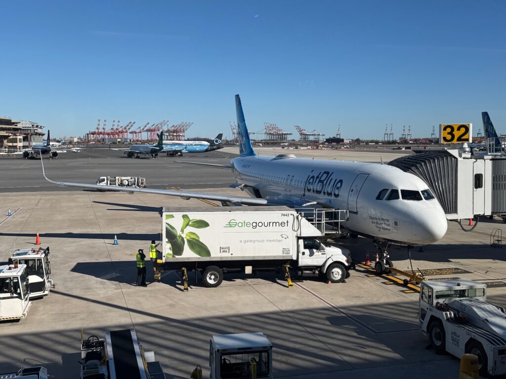 JetBlue Retreats From Newark, Making A United Merger Even More Likely a plane parked at an airport