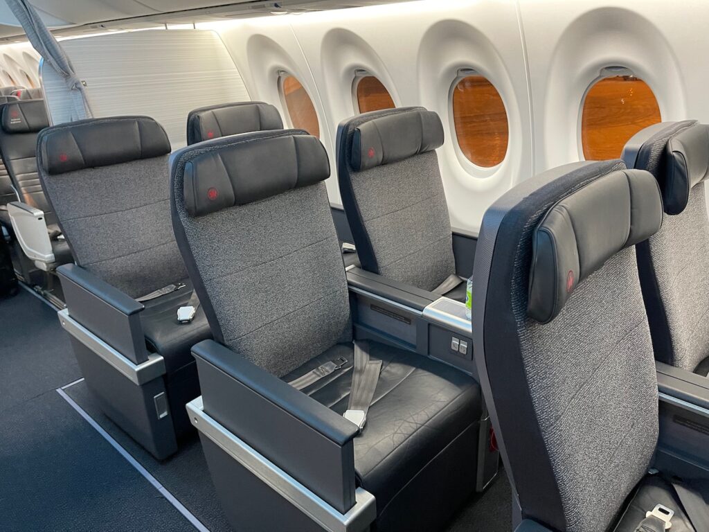 Air Canada Passenger Lost Her Business Class Seat. Then The COO Gave Her His. a row of seats in an airplane