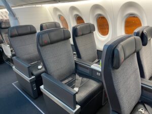 Air Canada Passenger Lost Her Business Class Seat. Then The COO Gave Her His. a row of seats in an airplane