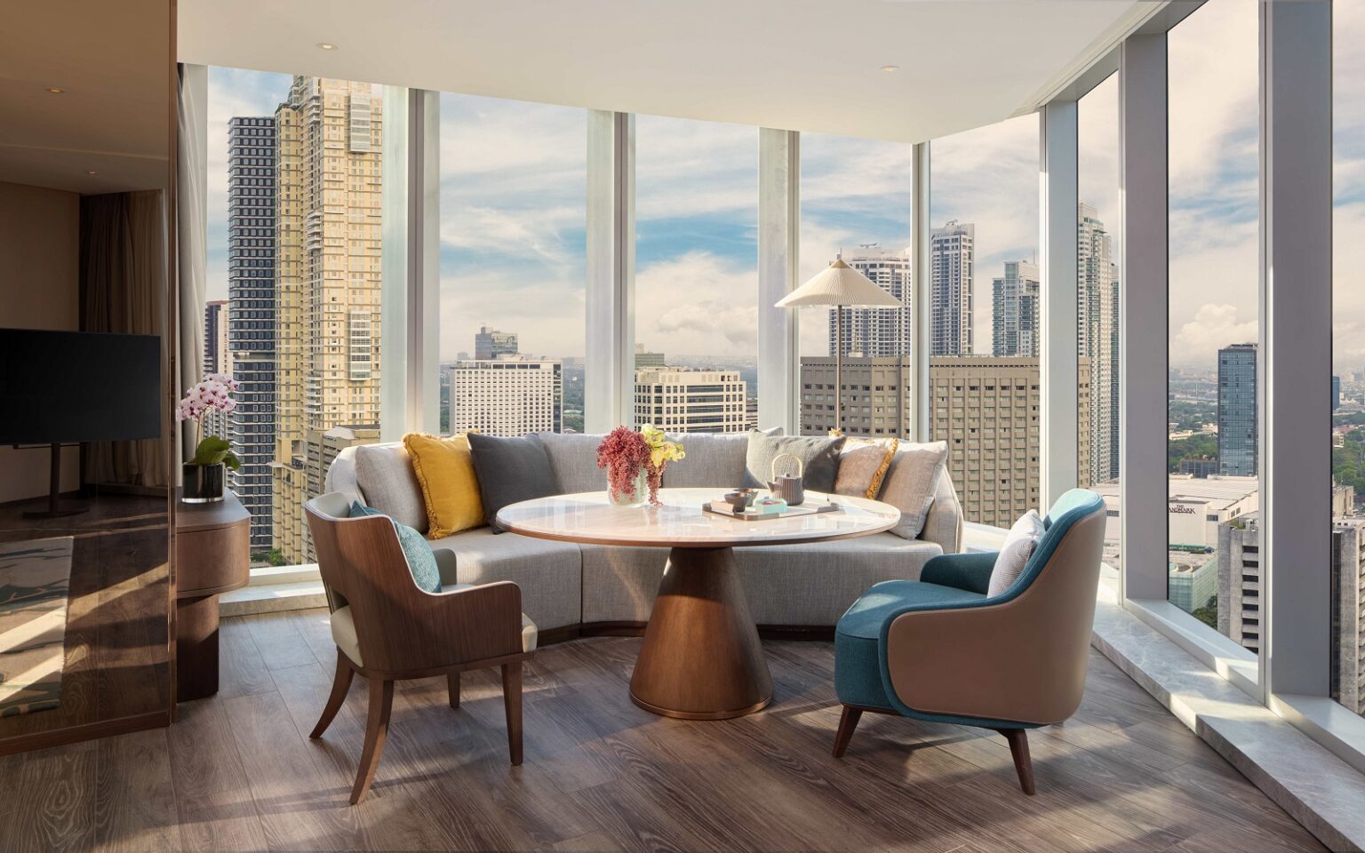 Mandarin Oriental returns to Manila Manila city skyline from the Junior Suite Living and Dining area at Mandari