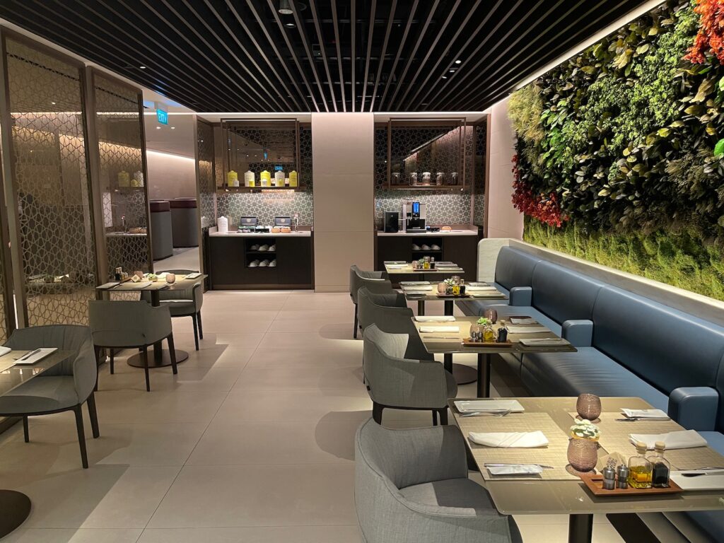 Qatar Airways Plans Two Frankfurt Lounges, Likely With Its London-Style Access Split a restaurant with tables and chairs