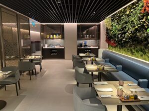 Qatar Airways Plans Two Frankfurt Lounges, Likely With Its London-Style Access Split a restaurant with tables and chairs