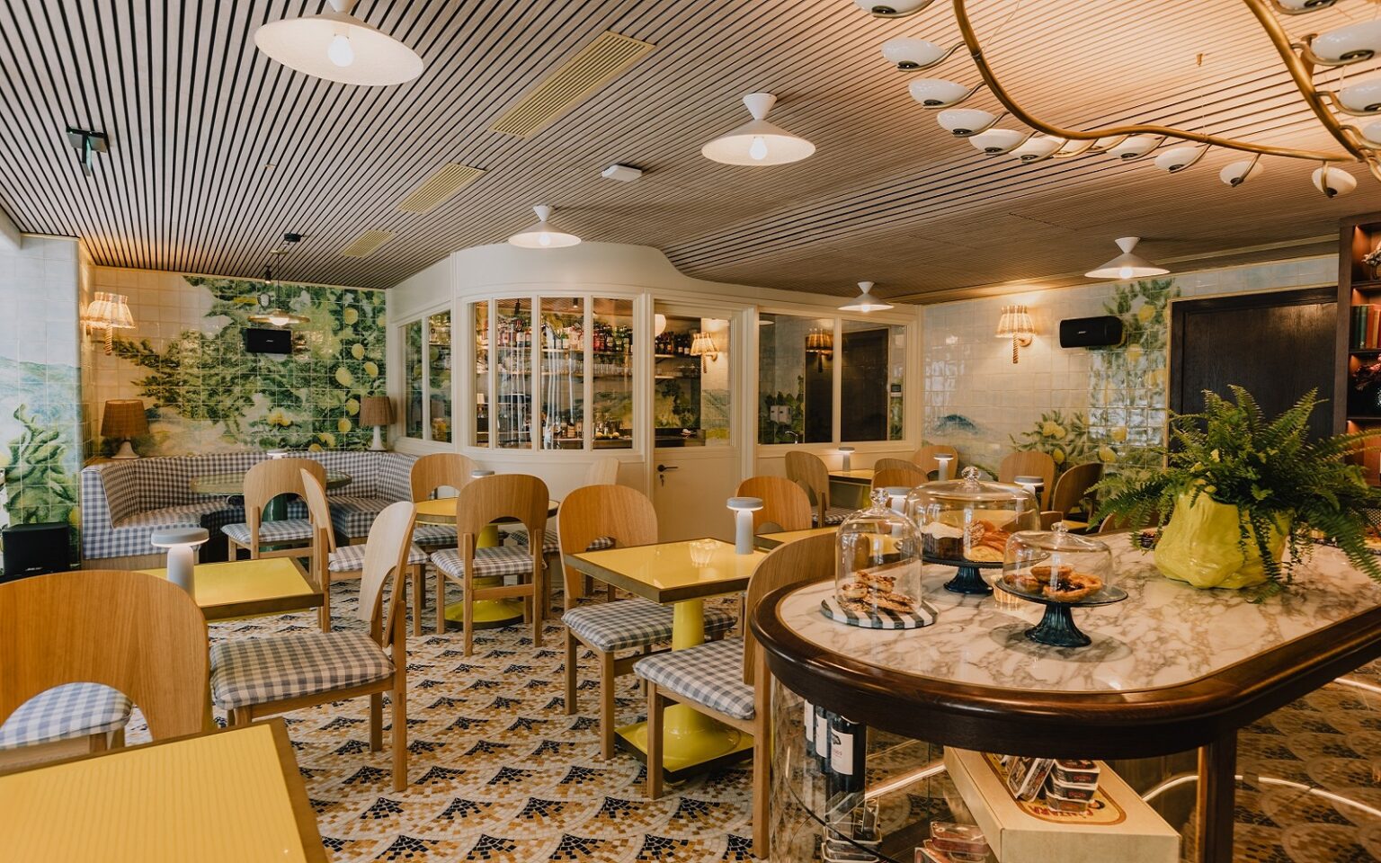 A duo of summer openings from Wilde restaurant and lobby space under curved lighting feature in Wilde Porto