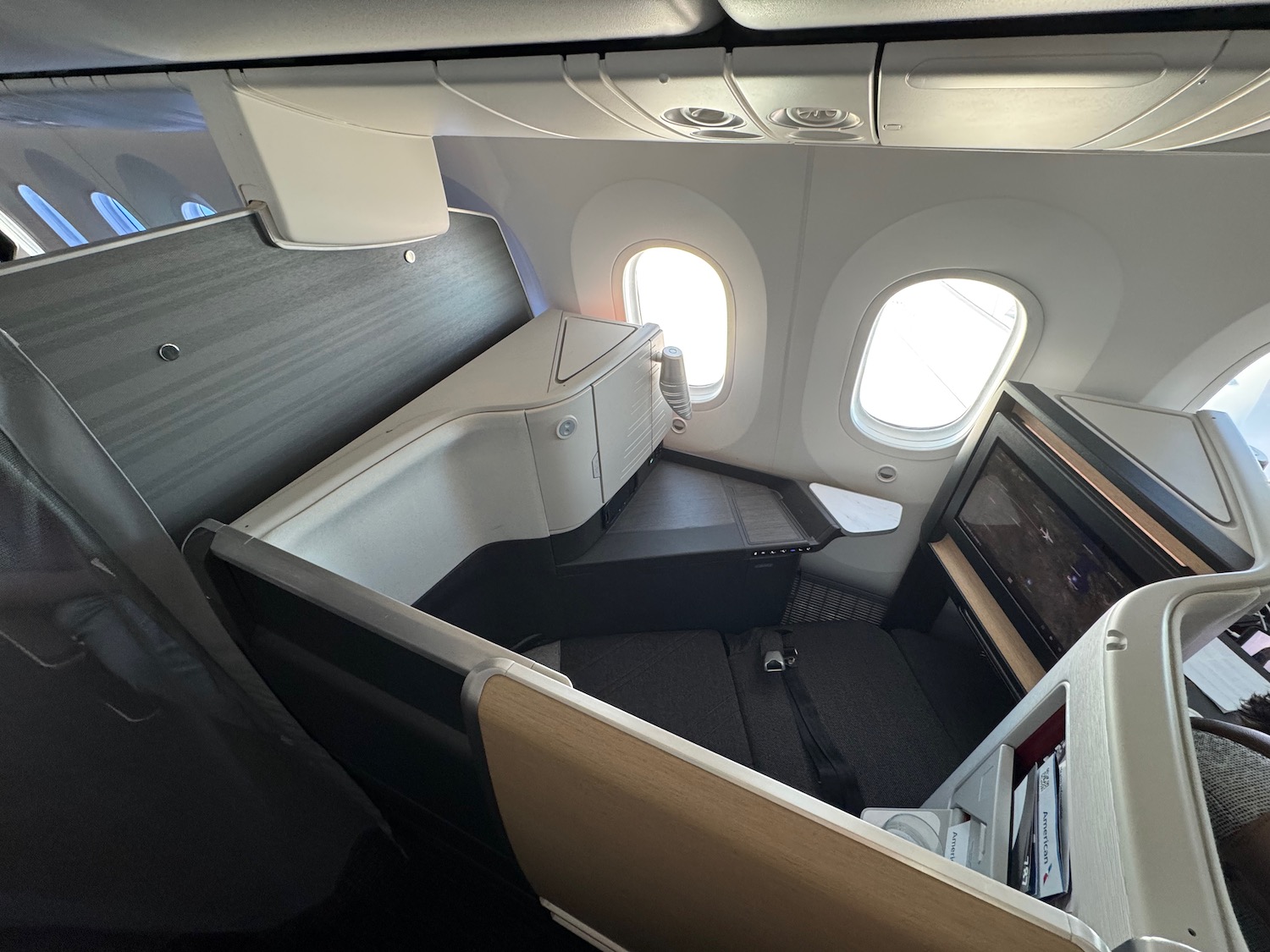 a seat and a window in an airplane