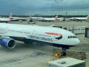 All Three British Airways Pilots Struck By Food Poisoning Midflight, One Incapacitated At 30,000 Feet a large white airplane at an airport
