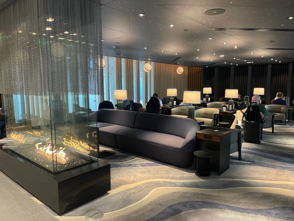 American Airlines’ Admirals Club Price Hike Makes Citi’s $695 Executive Card Look Cheap a room with a fireplace and couches
