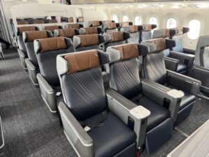 American Airlines Quietly Downgrades Elite Upgrades On Premium Domestic Routes a row of seats in an airplane