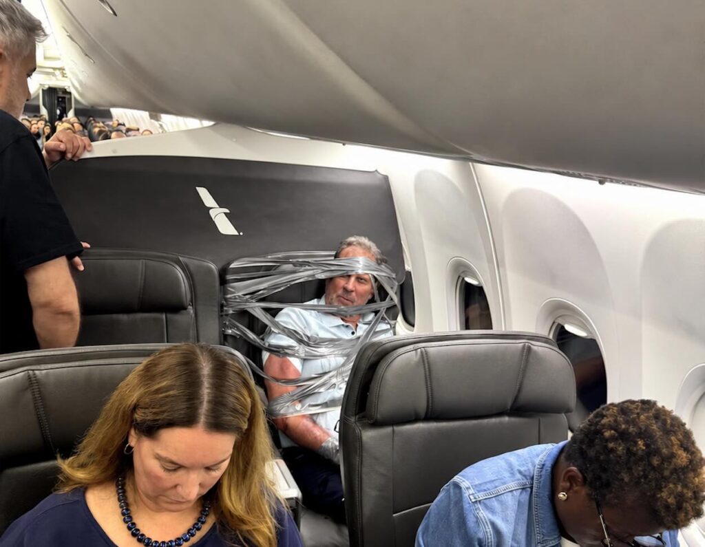 Horrible: American Airlines First Class Passenger Chokes Seatmate, Bites Rescuer, Gets Duct-Taped To His Seat