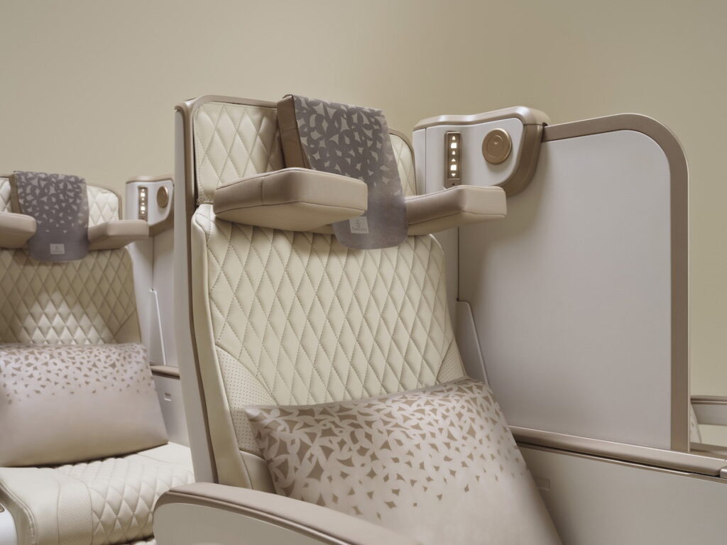 Emirates Unveils New Premium Economy Seat: It Might Be The World’s Best New Emirates premium economy seat showing the adjustable divider lowered between seats
