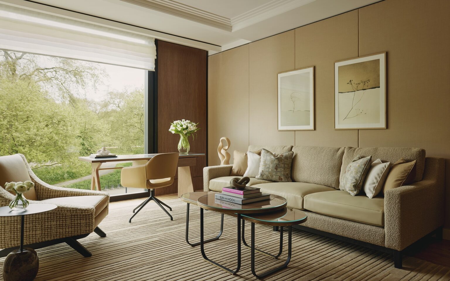 Maybourne owners agree new ownership structure for ultra-luxury hospitality group sofa, chair and table in muted natural colours in the balcony suite of The Emory Hotel London