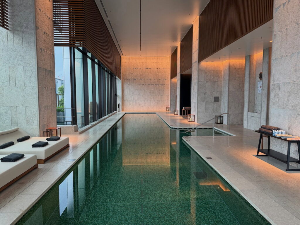 Bulgari Hotel Tokyo Review: Italian Style Meets Japanese Hospitality Indoor swimming pool with high ceilings and city views at Bulgari Hotel Tokyo