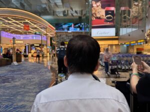 Singapore Airlines Adds A Personal Concierge For First Class Passengers, From Check-In To The Aircraft Door a man in a white shirt