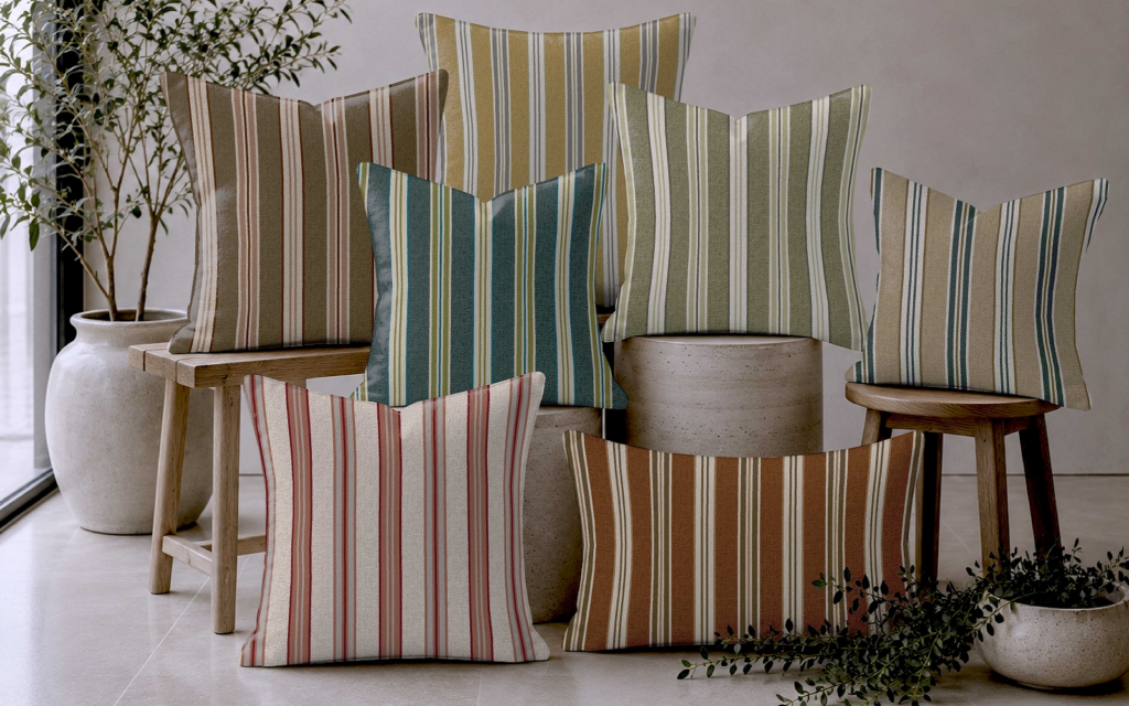 Skopos Studio: four new statement designs for hospitality interiors a pile of striped cushions in Poole stripe from Skopos