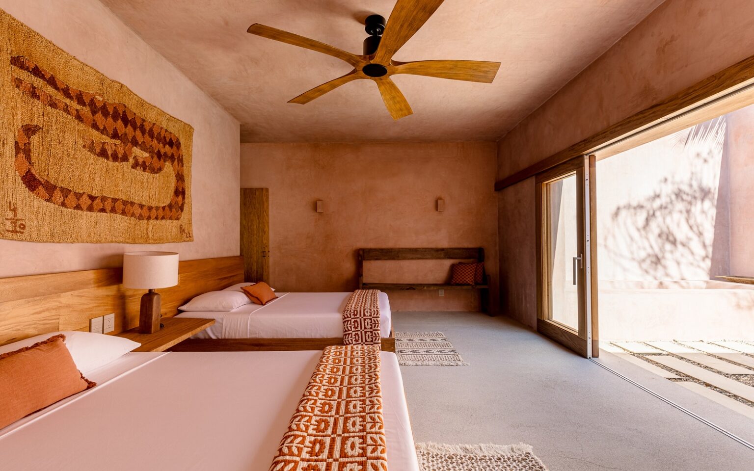 Pelican House – anchoring the bedroom moodboard earthy tones, wooden fan, woven wallhanging in Casa Coco